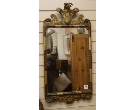 A George I design parcel gilt wall mirror, with shell and acanthus plume pediment H.90cm