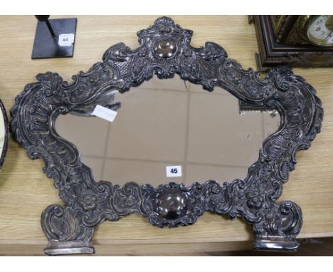 A late 19th century Italian plated and embossed cartouche shaped wall mirror length 72cm
