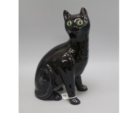 A Bretby ceramic black cat with glass eyes height 34cm