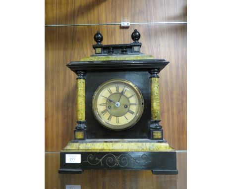 A VINTAGE CASED WOODEN MANTLE CLOCK 