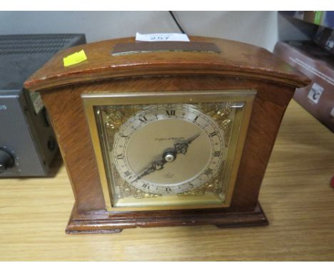 A WOODEN CASED ELLIOTT MANTLE CLOCK RETAILED BY MAPPIN AND WEBB WITH DEDICATED MAP TO TOP 