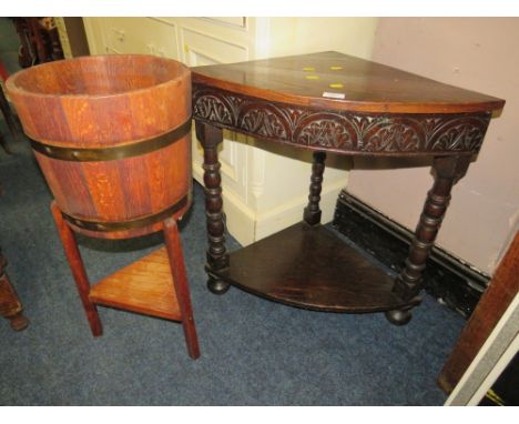 AN OAK BARREL PLANTER TOGETHER WITH A CARVED CORNER TABLE