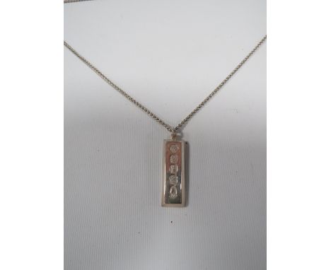 A MENS VINTAGE 1 oz SILVER INGOT ON A SILVER CHAIN