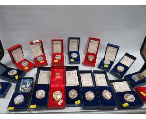 A COLLECTION OF 18 HALCYON DAYS ENAMEL TRINKET BOXES TO INCLUDE LIMITED EDITION DAWN OF THE 21ST CENTURY EXAMPLES AND VALENTI