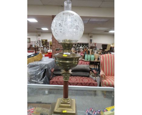 A VINTAGE OIL LAMP WITH TWIN BURNER AND DECORATIVE ETCHED GLASSED SHADE