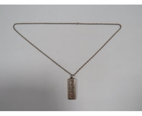 A MENS VINTAGE 1oz SILVER INGOT ON A SILVER CHAIN