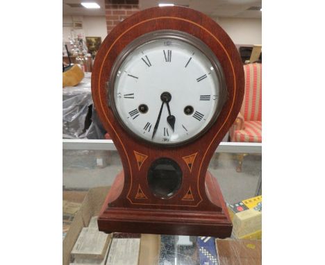 AN EDWARDIAN WOODEN CASED BALLOON SHAPED MANTLE CLOCK KEY (NO PENDULUM)