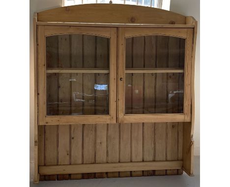 A pine glass fronted 2 door dresser top with interior and top shelf, slatted back and shaped sides. Complete with cup hanging