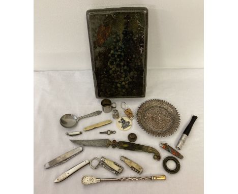 A vintage C.W.S. biscuit tin containing a mixed collection of items. To include various penknives and fruit knifes, caddy spo