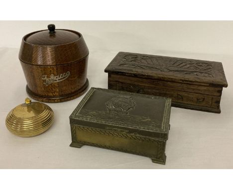 A collection of vintage wooden and brass lidded boxes. A vintage wooden tobacco jar and a brass ashtray, together with a carv