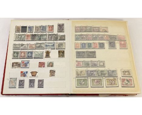 A red vintage stamp stock book containing world stamps. To include examples from: Japan, Kuwait, Poland and Romania. 