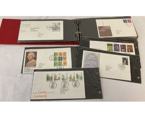 A red folder containing a quantity of First Day Covers dating from 1979-81.  