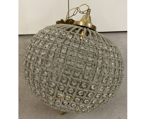 A heavily beaded spherical shaped Empire style lamp shade with brass detail.  Approx. 38cm diameter.