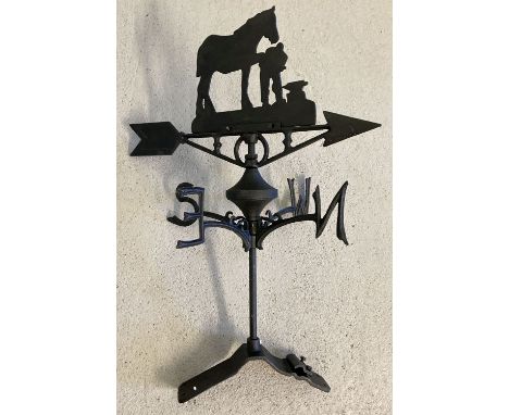 A black cast metal weather vane with blacksmith detail finial to top. Complete with ridge fitting. Approx. 67cm tall.