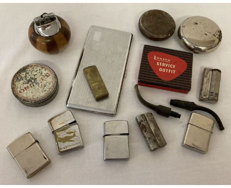 A collection of vintage smoking related items. To include: lighters, tobacco tins and cigarette case. 