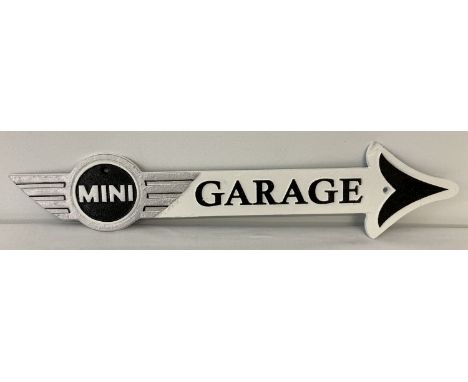 A painted cast metal Mini garage arrow wall sign. In black, white and silver. Approx. 11cm tall x 50cm long.