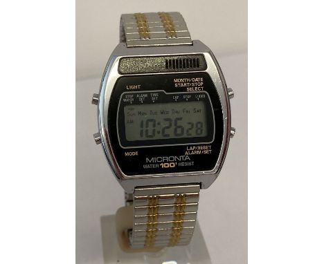 A men's vintage digital wrist watch by Micronta with Fixoflex expandable stainless steel strap. Digital display working. 