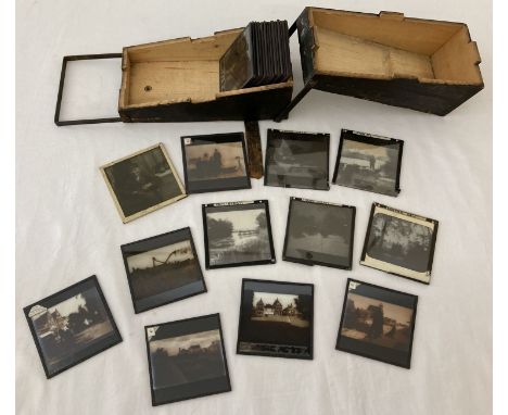 A wooden box containing a quantity of vintage magic lantern slides. To include views of Norfolk and Country Life. 