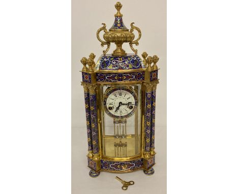 A large ornate brass and cloisonné wind up mantle clock with swing pendulum movement. Enamelled face with roman numeral marke