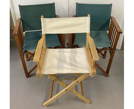 3 wooden framed director chairs with canvas seats and backs. A matching pair with green canvas seats and backs and a light wo