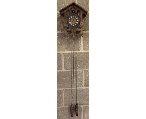 A vintage Black Forest wall hanging cuckoo clock with chains and weights,  a/f.  