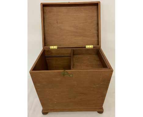 A vintage slope sided wooden box raised on 4 bun feet with sliding tray to interior.  Approx. 27 x 32 x 25cm.