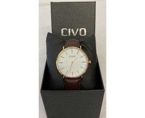A boxed men's wrist watch by Civo. White dial with gold tone case, hours markers and hands. Brown leather strap and water res