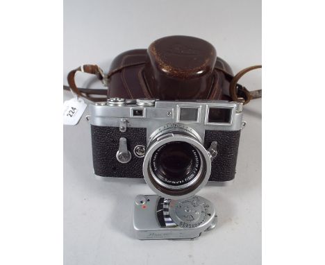 A Leica 35mm Camera, M3-952734 with Summicron Lens and Leica Light Meter with Original Leather Caser and Lens Fitting.