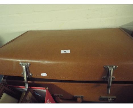 A Vintage Suitcase and A Lamp Shade. 