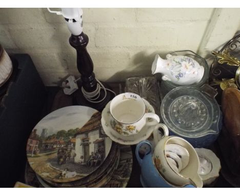 A Tray Containing Royal Doulton decorated Plates, Journey Through the Village, Glass Ware Table Lamp Etc. 