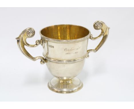 Victorian silver gilt twin handled trophy cup, London 1899, engraved 'October 1851 - 1901', 14cm x 20cm 