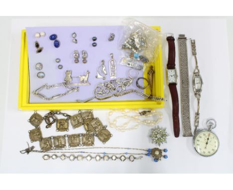 A collection of silver and costume jewellery to include  silver bracelets, paste brooches, gtwo fashion wristwatches and a Ca