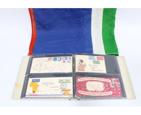 An album with vintage  South African Rand bank notes, First Day covers and stamps, South Africa flag and others, etc (a lot) 