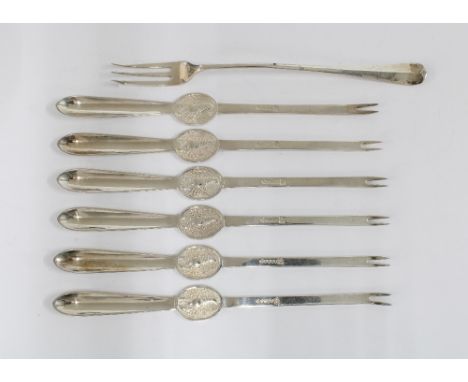 Sheffield silver pickle fork and a set of six silver plated lobster picks (7) 