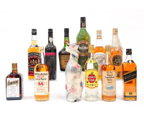 A MIXED GROUP OF SPIRITS INCLUDING A CASED BOTTLE OF BOWMORE LEGEND SINGLE MALT SCOTCH WHISKY (12)Also including Glenfiddich 