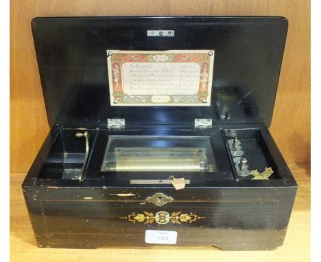 A 19th century Swiss musical box, the 11cm comb and barrel playing six airs, with original list of airs, in rosewood and stai