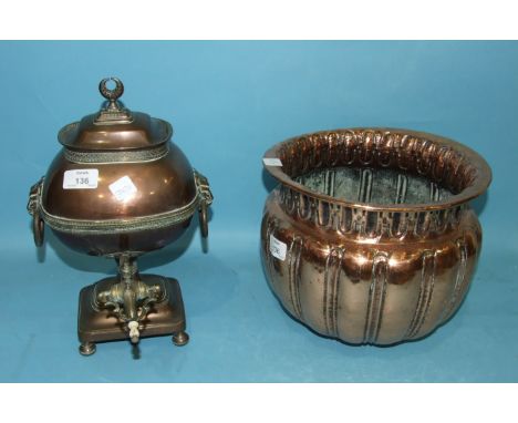 A 19th century Asian copper samovar, the lion mask ring handles and brass tap complete with interior fitment and raised on a 