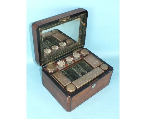 A Victorian ladies burr walnut dressing case fitted with seven plated-mount bottles and trinket bottles and three glass bottl