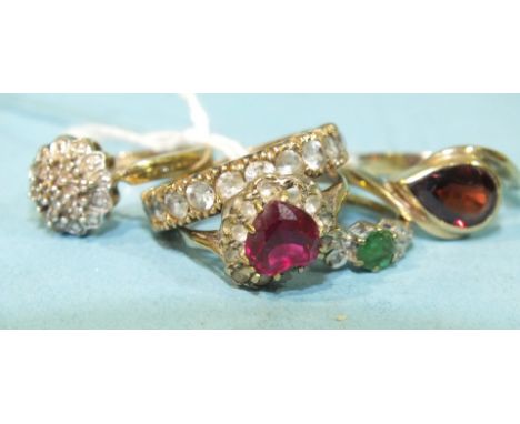 A small emerald and diamond-set 9ct gold ring, size J, a garnet set 9ct gold ring, size N and three other gem-set rings, 12g,