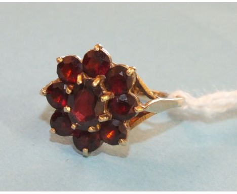 A garnet cluster ring, claw set nine garnets in 9ct gold mount, size L, 3.3g.