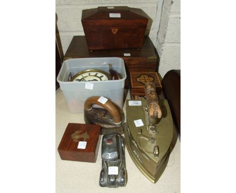 A Victorian brass smoothing iron, a matching sarcophagus-shaped tea caddy and other items.