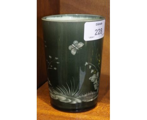 A 19th century English ceramic beaker with etched decoration of a butterfly amongst a foliate design, 11.5cm high.