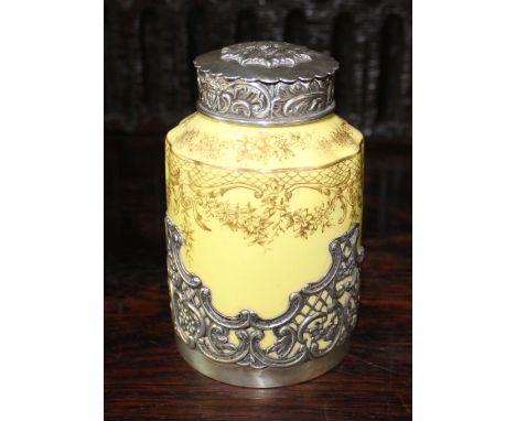 Victorian silver hallmarked silver mounted porcelain tea caddy, yellow body with gilt detail, repousse C scroll mount and cov