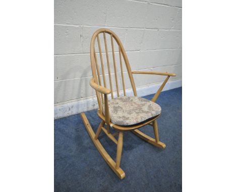 AN ERCOL BLONDE ELM AND BEECH QUAKER ROCKING CHAIR (condition report: general signs of usage, some stains to frame)