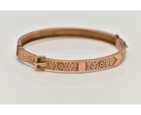 A LATE VICTORIAN 9CT ROSE GOLD HINGED BANGLE, belt and buckle design with ivy leaf detail, fitted with a push pin clasp, miss
