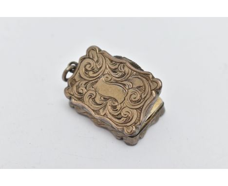A VICTORIAN SILVER VINAIGRETTE OF WAVY RECTANGULAR OUTLINE, foliate engraved decoration, vacant scroll cartouche, gilt interi
