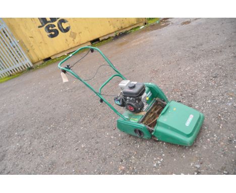 A QUALCAST CLASSIC PETROL 35s cylinder mower with grass box and a Kawasaki FJ100D engine. (Engine pulls freely but hasn't bee