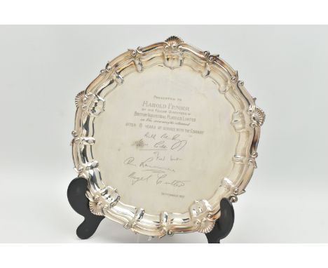 AN ELIZABETH II SILVER SALVER WITH PRESENTATION INSCRIPTION, shell and scroll border, the centre engraved 'PRESENTED TO HAROL