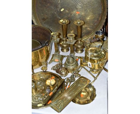 A LARGE QUANTITY OF BRASSWARE, comprising a large circular table top/drinks tray, decorated with a Middle Eastern design and 