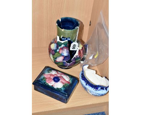 TWO PIECES OF MOORCROFT POTTERY AND A MACINTYRE SUGAR BOWL, all in very poor condition, the Moorcroft Pottery comprising an O